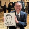 企業パーティーで早描き似顔絵を制作する出張似顔絵師・田村まりり